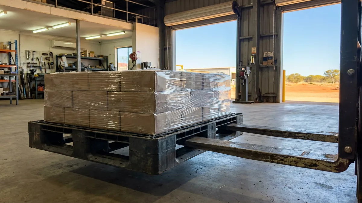 Medium Duty Used Plastic Pallet in use